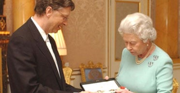 The Queen presents Bill Gates with his honorary knighthood at Buckingham Palace. Photograph: Chris Young/AP
