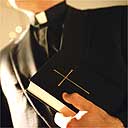 Priest with bible