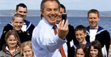 Tony Blair with youngsters at Weymouth, where, at the launch of Labour's campaign, they showed him how to take a picture with a mobile phone