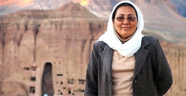 Habiba Sarobi, Afghanistan's first female governor. In the background is the site of Bamiyan's destroyed Buddhas