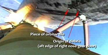 A Nasa graphic points out two areas on the heat shield on the bottom of the space shuttle Discovery where tile damage may have occurred during launch