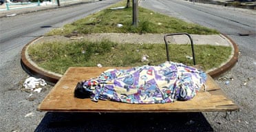 A dead body lies in Rampart Street, New Orleans