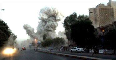 A huge explosion is seen near the Palestine hotel in Baghdad. Photograph: Khalid Mohammed/AP
