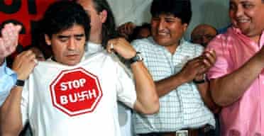 Former football star Diego Maradona shows his T-shirt with an anti-George Bush slogan. Photograph: Daniel Luna/AP
