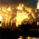 Low winter sunshine highlights the volume of emissions from Drax power station near Selby, Yorkshire