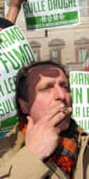 The leader of Italy's Green party, Paolo Cento, smokes during a protest against the government's  new zero-tolerance policy on drugs. Photograph: Sandro Pace/AP 