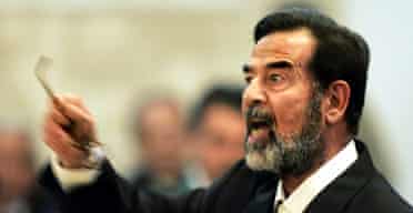 Saddam Hussein argues with the chief judge as he givess evidence for the first time during his trial in Baghdad. Photograph: Jacob Silberber/AP 