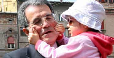 Romano Prodi holds his niece Chiara leaving a polling station in Bologna