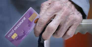 A pensioner with her new pension account card. Photograph: Christopher Furlong/Getty Images
