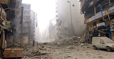 Smoke rises from demolished buildings in the Hizbullah stronghold of southern Beirut after Israeli air strikes on Sunday 16 July 2006