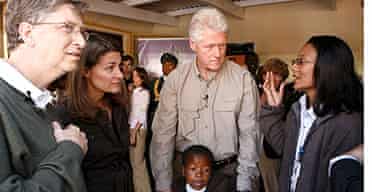 Bill Gates, his wife Melinda and Bill Clinton visit patients and staff at a HIV / Aids facility in Maseru, Lesotho, South Africa