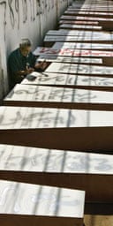 Coffins are prepared for mass burial in the Lebanese city of Tyre. 
