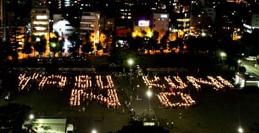 Protesters in Tokyo spell out 'Yasukuni no' with candles in protest at Koizumis visit to the controversial shrine 