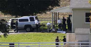 Police are seen outside the Amish school in Pennsylvania where a gunman shot dead three girls before killing himself. Photograph: Matt Rourke/AP