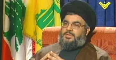 Hizbullahs leader, Sayyed Hassan Nasrallah speaks to a reporter on his groups Manar television channel