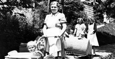 German nurses take babies out for fresh air in the grounds of a former hotel in the Bavarian resort of Bad Wiessee in June 1945