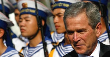 The US president, George Bush reviews a guard of honour at the presidential palace in Hanoi at the start of his visit to Vietnam
