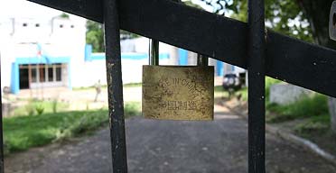 A padlock keeps the gate shut at Africas oldest nuclear reactor facility at the University of Kinshasa