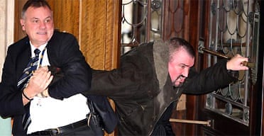 Uproar at Stormont as loyalist killer with bomb tries to storm assembly, UK news