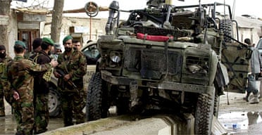 The Nato vehicle hit by a suicide bomb which killed three Afghans and injured three Britons. Photograph: Allauddin Khan/AP