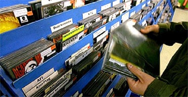 A shopper looks through records at Spillers Record shop in Cardiff