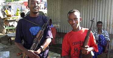 Somali militiamen hold weapons they looted after Islamists fled Mogadishu