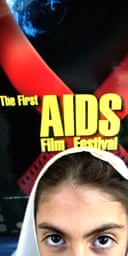 A student stands in front of a poster advertising Iran's first HIV/Aids film festival