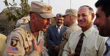 Lieutenant General David Petraeus meeting the mayor of Mosul, Iraq, in 2003.