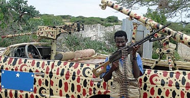 An Islamist gunman patrols a junkyard in the outskirts of the Somali capital Mogadishu.