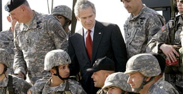President Bush talks to troops during a demonstration of infantry training at Fort Benning, Georgia