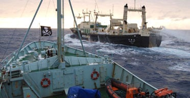 The Robert Hunter, a ship operated by the anti-whaling group Sea Shepherd Conservation Society, (foreground) follows the Japanese whaling ship Nisshin Maru in Antarctic waters