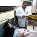 An Iraqi medic treats a victim of a chlorine tanker explosion north of Baghdad