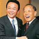 The Chinese foreign minister, Li Zhaoxing (r), is welcomed by his Japanese counterpart, Taro Aso, at talks in Tokyo last month