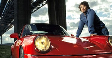 Author Iain Banks with one of his Porsches