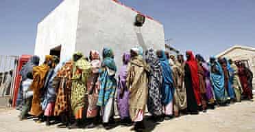 Displaced Sudanese women queue for a medical checkup at a Red Crescent hospital in the Darfur city of Nyala.