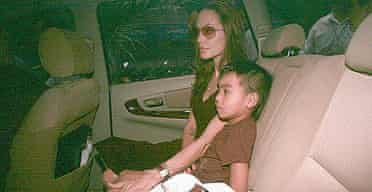 Angelina Jolie with her adopted son Maddox, from Cambodia, as she leaves Tam Binh orphanage in Ho Chi Minh City, where she adopted a three-year-old Vietnamese boy. Photograph: AP