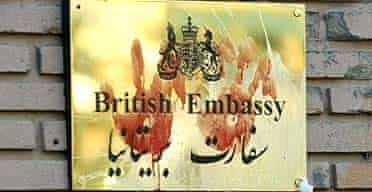 Bloody handprints on the plaque of the British embassy in Tehran