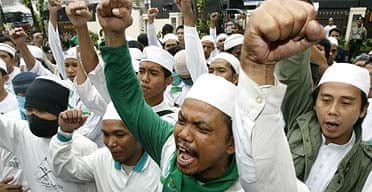 Members of the hardline Islamic Defenders Front demonstrate against Playboy Indonesia outside the court