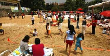 People enjoy the sand during the opening day of Mexico City's first of four city beaches