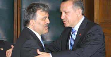 Turkish foreign minister Abdullah Gul, left, and the prime minister, Recep Tayyip Erdogan, embrace 