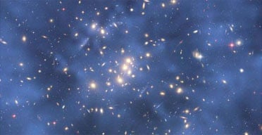 A dark matter ring in Galaxy cluster Cl 0024+17 (ZwCl 0024+1652). Photograph: NASA/ESA/Johns Hopkins University