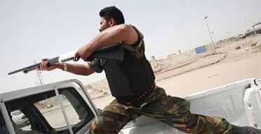 A member of the Gods Revenge, a Shia militia with strong ties to Iran, on patrol in Basra