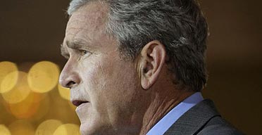 President Bush delivers a speech on the Middle East in the Cross Hall of the White House. 