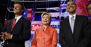 Democratic presidential candidates John Edwards, Hillary Clinton and Barack Obama are applauded on stage prior to the start of the CNN/YouTube debate. 
