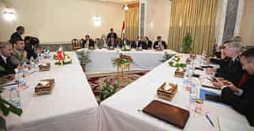 American and Iranian diplomats meet at the office of the Iraqi prime minister, Nuri al-Maliki, in Baghdad.