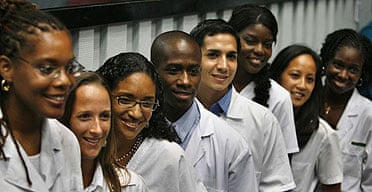 Eight US medical students pose for a graduation picture at the Latin American School of Medicine in Havana, Cuba.