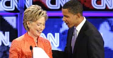 New York Senator Hillary Clinton speaks with Illinois Senator Barack Obama after the CNN/YouTube Democratic presidential candidates debate