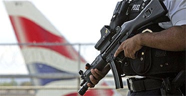 An armed British police officer on patrol outside Heathrow airport