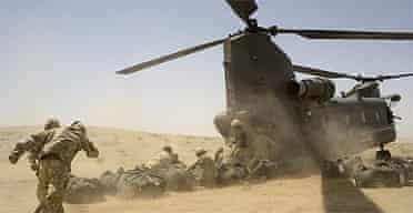 British soldiers loading supplies into a Chinook helicopter in southern Helmand province, Afghanistan