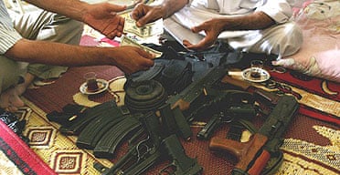 Weapons change hands for cash in a Baghdad home
